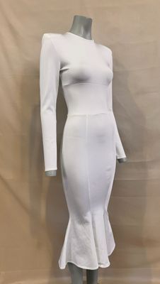 the dress is white and has long sleeves on it