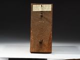 a small wooden box with a clock on top of it