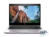 a laptop with a picture of a waterfall on the screen