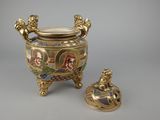 an image of a gold and enamel vase with a lid