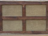 a picture of an old window with a wooden frame on it