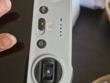 a person that is holding a remote control in their hand