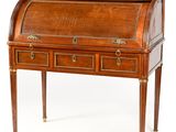 an antique writing desk with two drawers and brass trimmings