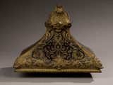 an antique bronze clock with a bird on top of it