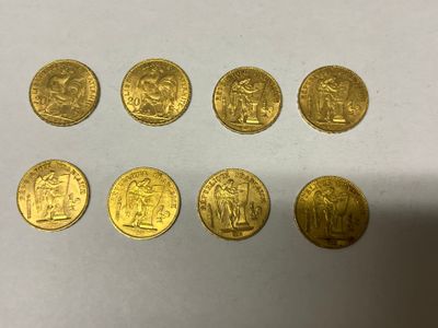a close up of a bunch of gold coins on a table