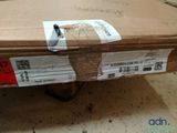 a cardboard box with a piece of paper on top of it