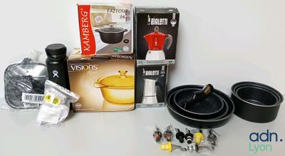 the contents of a kitchen set including pots and pans