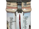 a beer steine with a bird on top of it