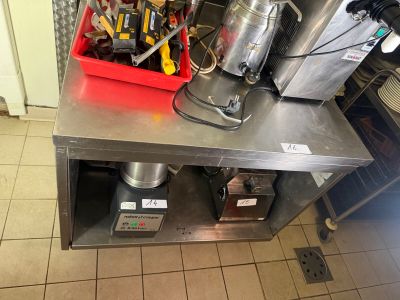 a picture of a kitchen with a lot of tools on the counter