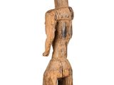 an old wooden statue of a woman with a hat on her head