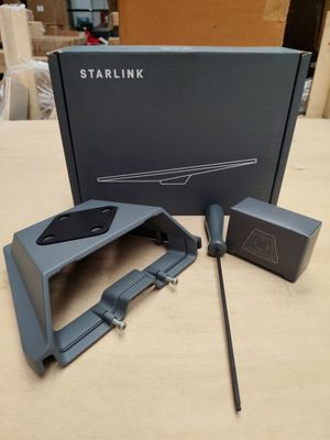 a box with a remote and a mouse on a table