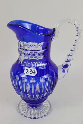 blue glass pitcher with a number on the side of it