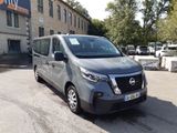 a grey van that is parked in front of a building