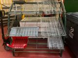 a metal cart that has a bunch of baskets on it