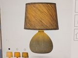 a box with a lamp inside of it on a table