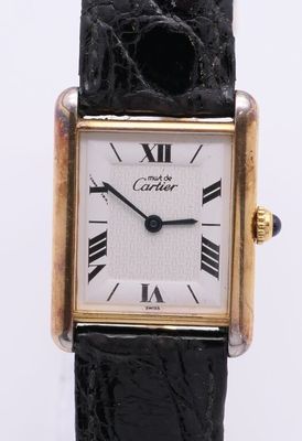 an image of a close up of a wrist watch with roman numerals
