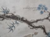 a picture of a painting of birds and flowers on a wall