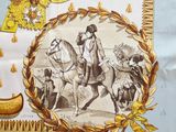 a picture of a table cloth with a picture of a man riding a horse