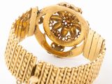 an image of a close up of a gold bracelet on a white background