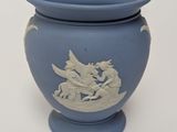 a blue vase with a picture of a dragon on it
