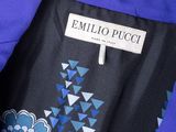 a close up of a blue jacket with blue flowers on it