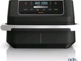 une friteuse à air chaud noire et argentée équipée d'une horloge numérique