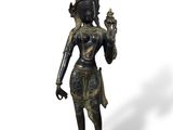 an image of a bronze statue of a woman holding a bird