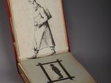 a book with a drawing of a man holding a baseball bat
