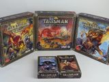 three games in a box on a white surface