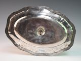a silver plate with a hole in the middle of it