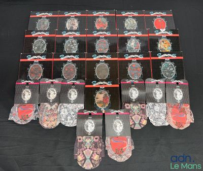 a lot of ties that are on a black table