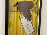 a picture of a picture of a person holding a tag
