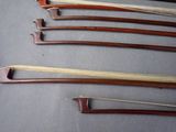 several pieces of wood are arranged in a row on a gray surface