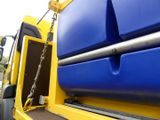 a blue and yellow truck with a chain attached to it