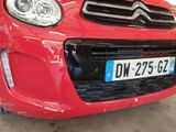 a red car that is parked in a garage