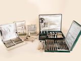 a lot of silverware in a case on a table