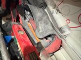 a pile of skis and ski poles sitting on a table