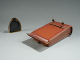 two pieces of luggage sitting next to each other on a table