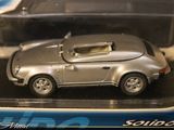 a toy car that is in a plastic box