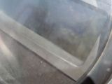 a close up of a motorcycle mirror on the side of the road