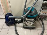 a vacuum that is sitting on the floor next to a door