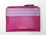 a close up of a pink and purple wallet with a zipper