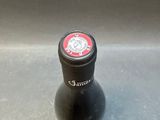 a bottle of wine that is sitting on a table