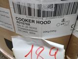 a cardboard box with a sticker on it sitting on the ground