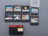 a lot of nintendo games on the table next to each other