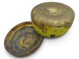 a yellow and brown container with a lid on a white surface