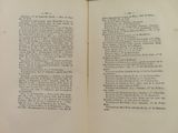 an open book with a page in it on a table
