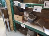 many boxes and containers on a shelf in a room
