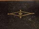a black box with a gold design on it