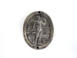 a picture of a silver medal with a man on it
